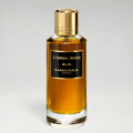 FBYMM Eternal Wood parfum in een glazen fles met gouden dop en zwart etiket, geur met houtachtige en oosterse noten.