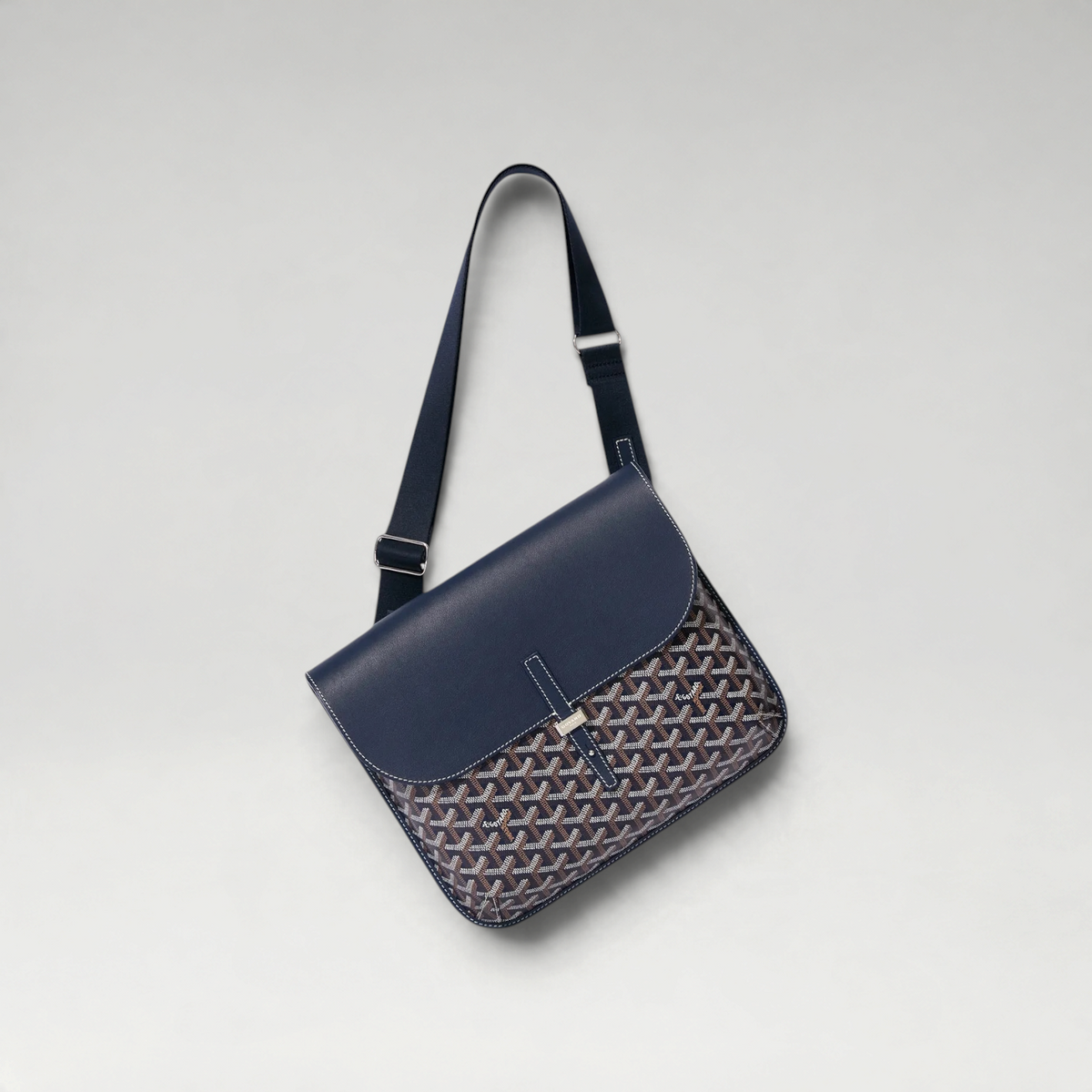 FBYMM Coursier messenger tas in marineblauw leer met iconisch patroon en verstelbare schouderriem