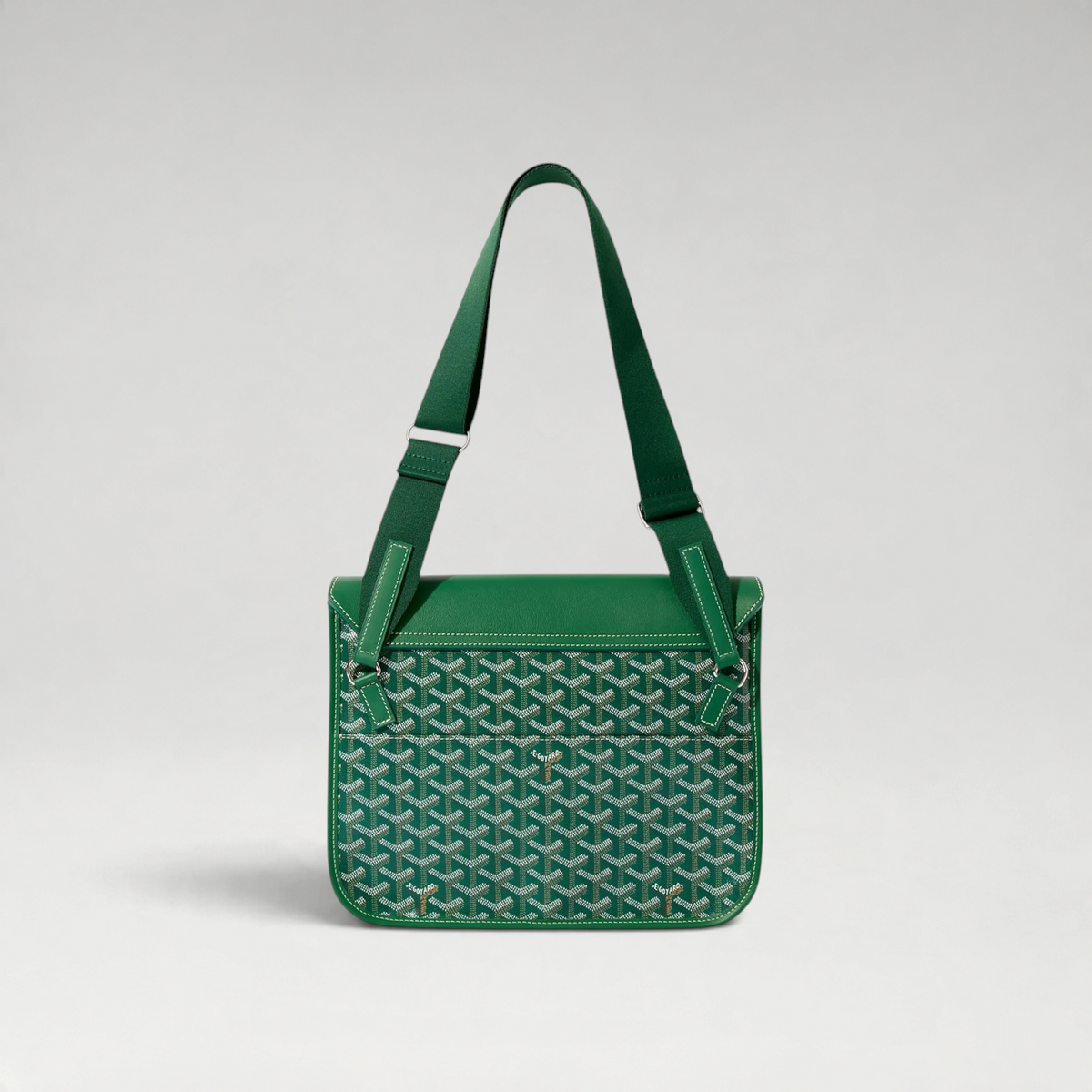 FBYMM Coursier messenger tas in groen leer met iconisch patroon, verstelbare schouderband en witte stiksels.